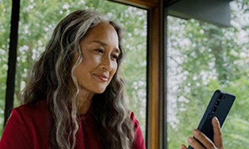 Image of a woman looking at her phone